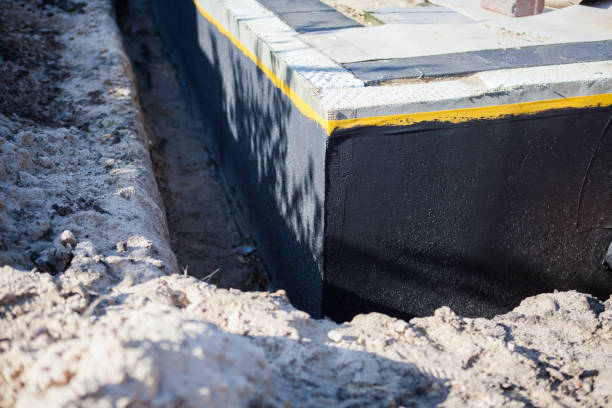 Professional Basement Waterproofing technician working in Hillsboro, IL